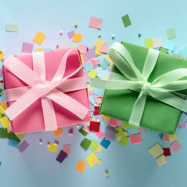 An image of two small wrapped presents on a blue background.