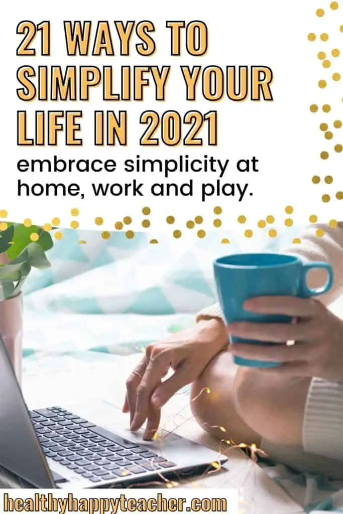 A woman's hand holding a cup of tea with the other hand typing on a laptop and the text overlay, 21 ways to simplify your life in 2021.