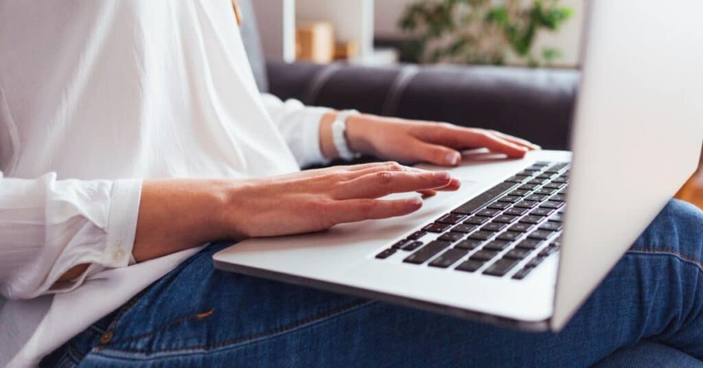 Close up on a woman working on a laptop