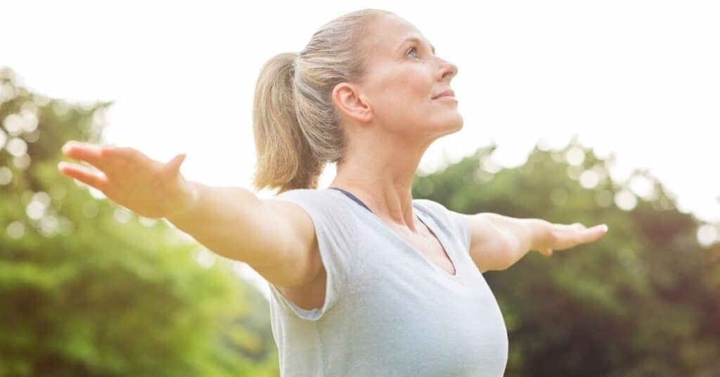 Woman stretching outside.